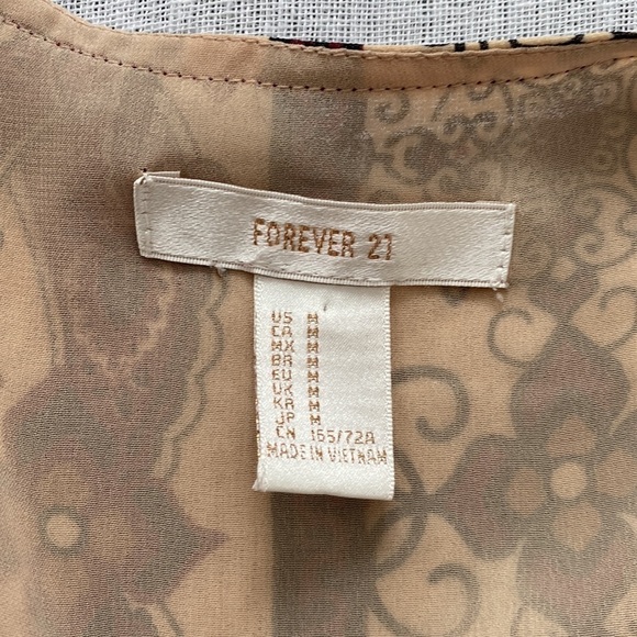 Forever 21 long sleeve boho jumpsuit with plunging neck line. - Picture 6 of 13